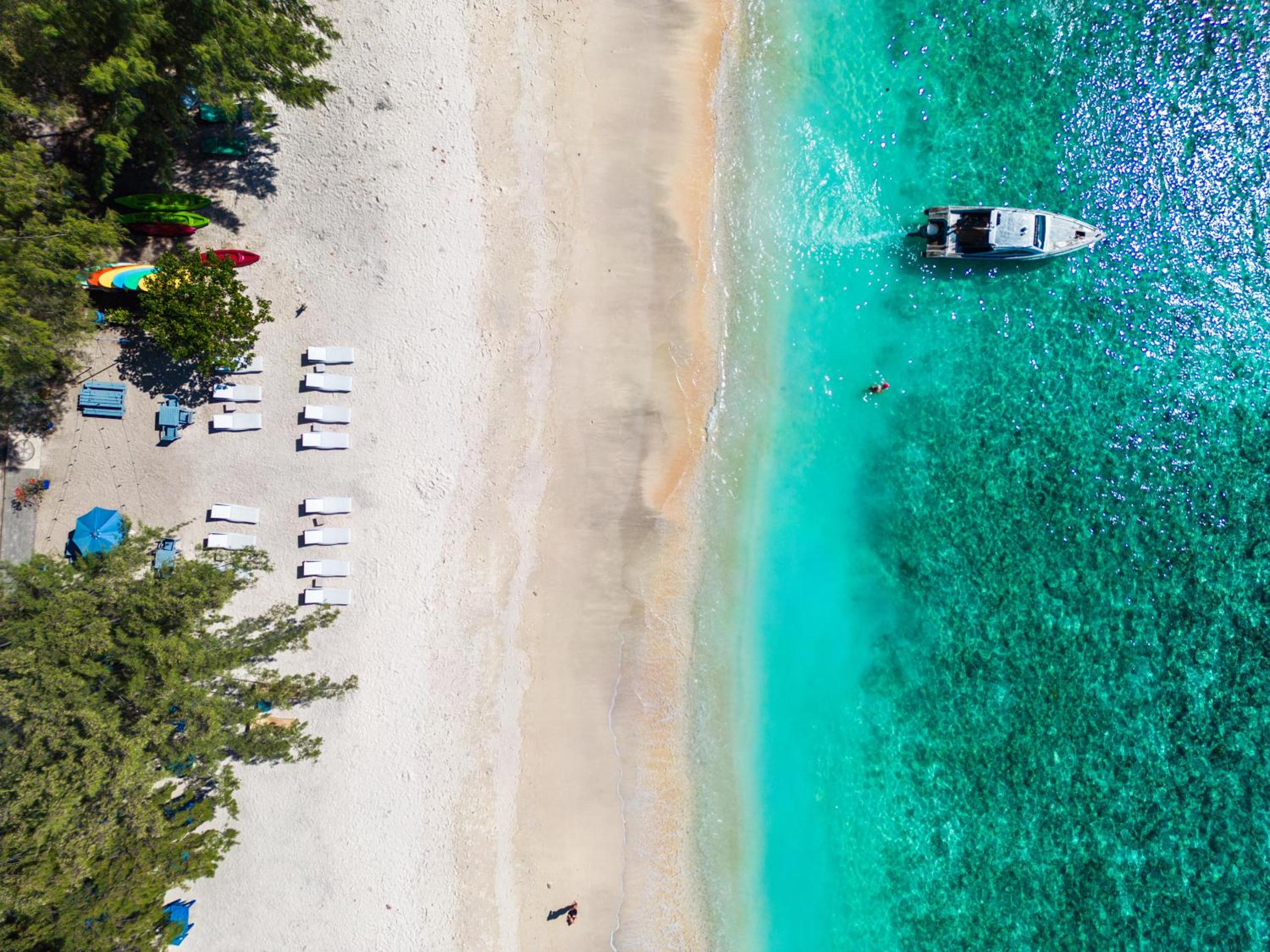Aerial beach and turquoise water near Balé Sampan