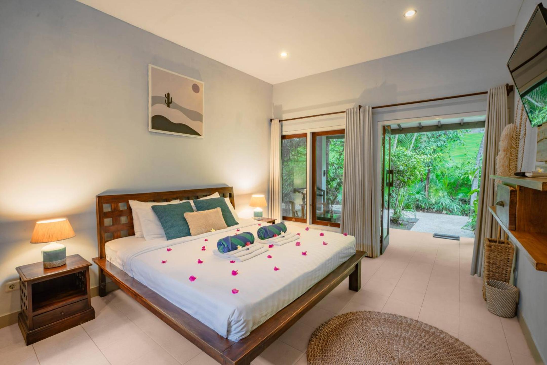 Bungalow bedroom interior at Balé Sampan